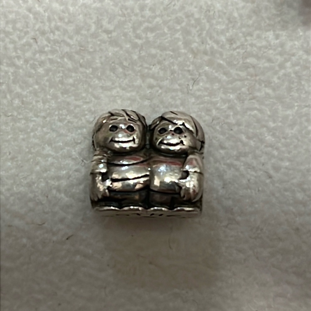 Authentic Chamilia brothers charm.